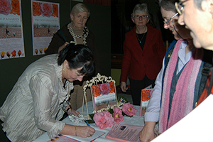 Derelie Cherry signing copies of  Two Dogs & A Garden at the launch in the Maiden Theatre at the Sydney Royal Botanic Gardens